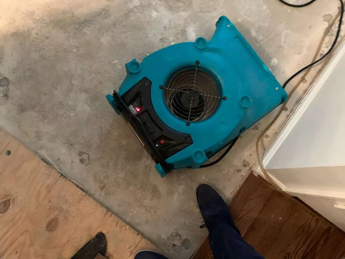 Air mover drying subfloor during Leak Detection & Repair in Rincon